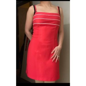 Coral dress with white details, great for spring events or business casual work